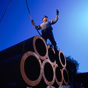 HFS Tubes Pile With Worker - Specialty Pipe and Tube